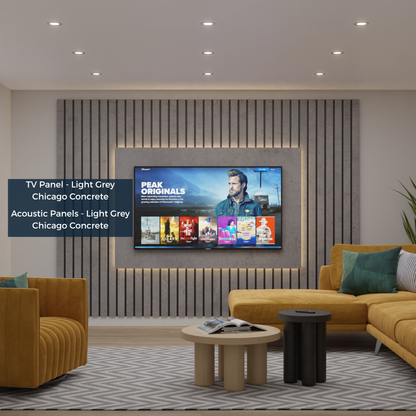 Modern living room with a TV mounted on a gray wall, featuring a gray acoustic panel system.